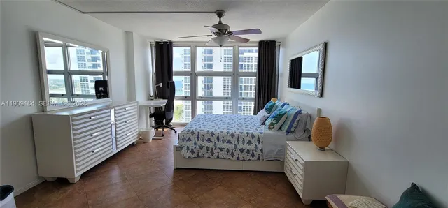 a bedroom with furniture and windows