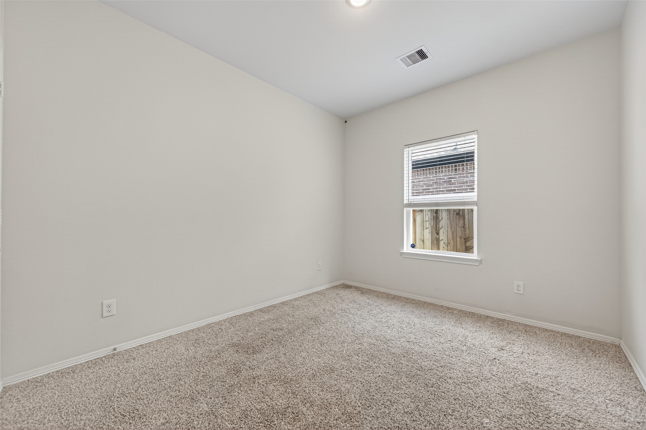 23222 Spring Genesis Lane Katy, TX 77493 - Photo 22 of 43 Cozy secondary bedroom featuring plush carpeting for added comfort.
