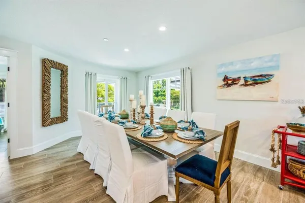 a view of a dining room with furniture window and wooden floor