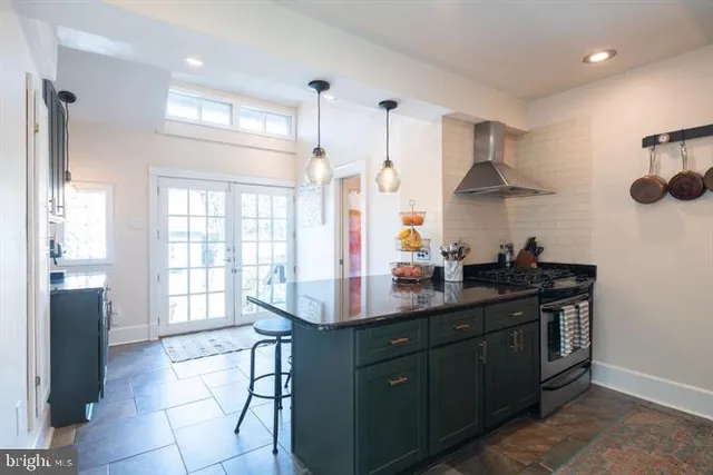 a kitchen with a sink stove and cabinets