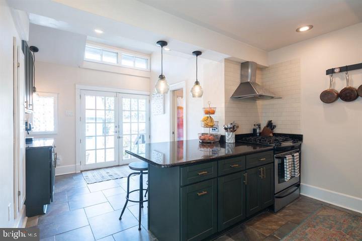 229 Benezet Street Philadelphia, PA 19118 - Photo 11 of 31 a kitchen with a sink stove and cabinets