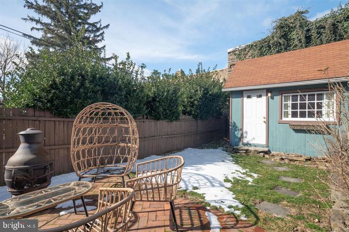 229 Benezet Street Philadelphia, PA 19118 - Photo 12 of 31 a view of a chair and table in the backyard