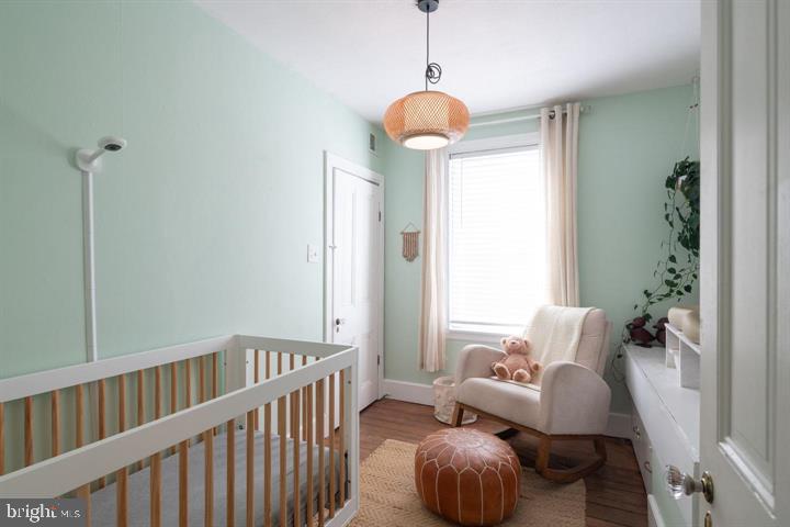 229 Benezet Street Philadelphia, PA 19118 - Photo 18 of 31 a living room with furniture and a large window