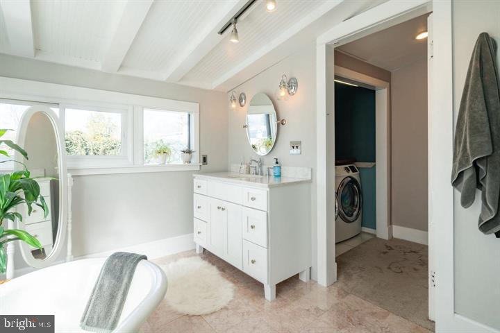 229 Benezet Street Philadelphia, PA 19118 - Photo 23 of 31 a view of a hallway with washer and dryer