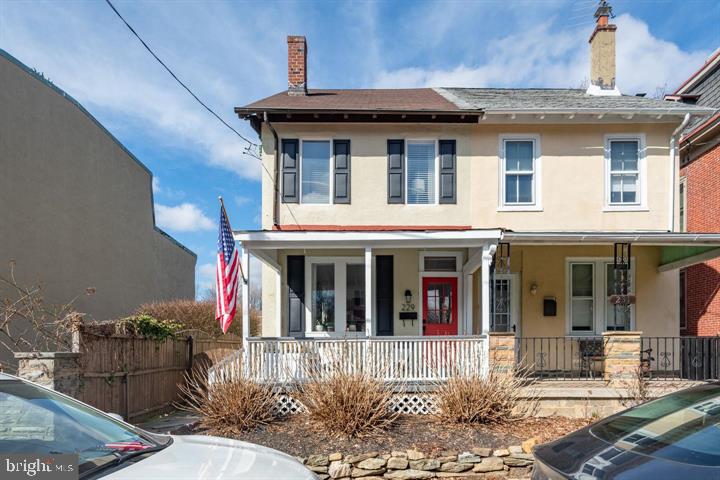 229 Benezet Street Philadelphia, PA 19118 - Photo 29 of 31 a view of a house with a large windows and a small yard