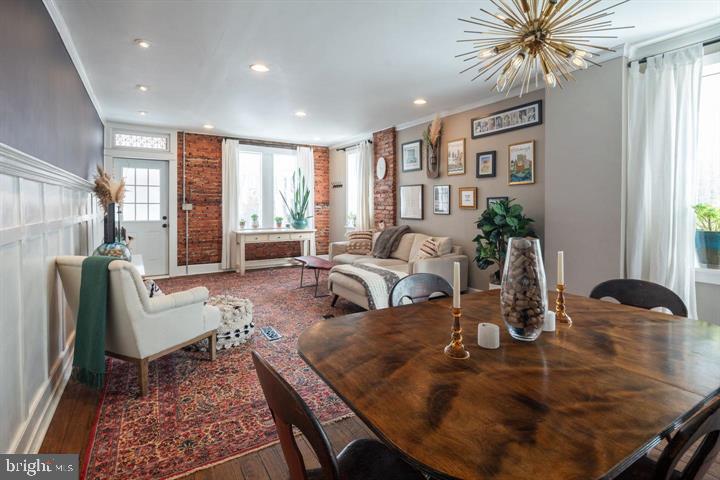 229 Benezet Street Philadelphia, PA 19118 - Photo 5 of 31 a living room with furniture and a large window