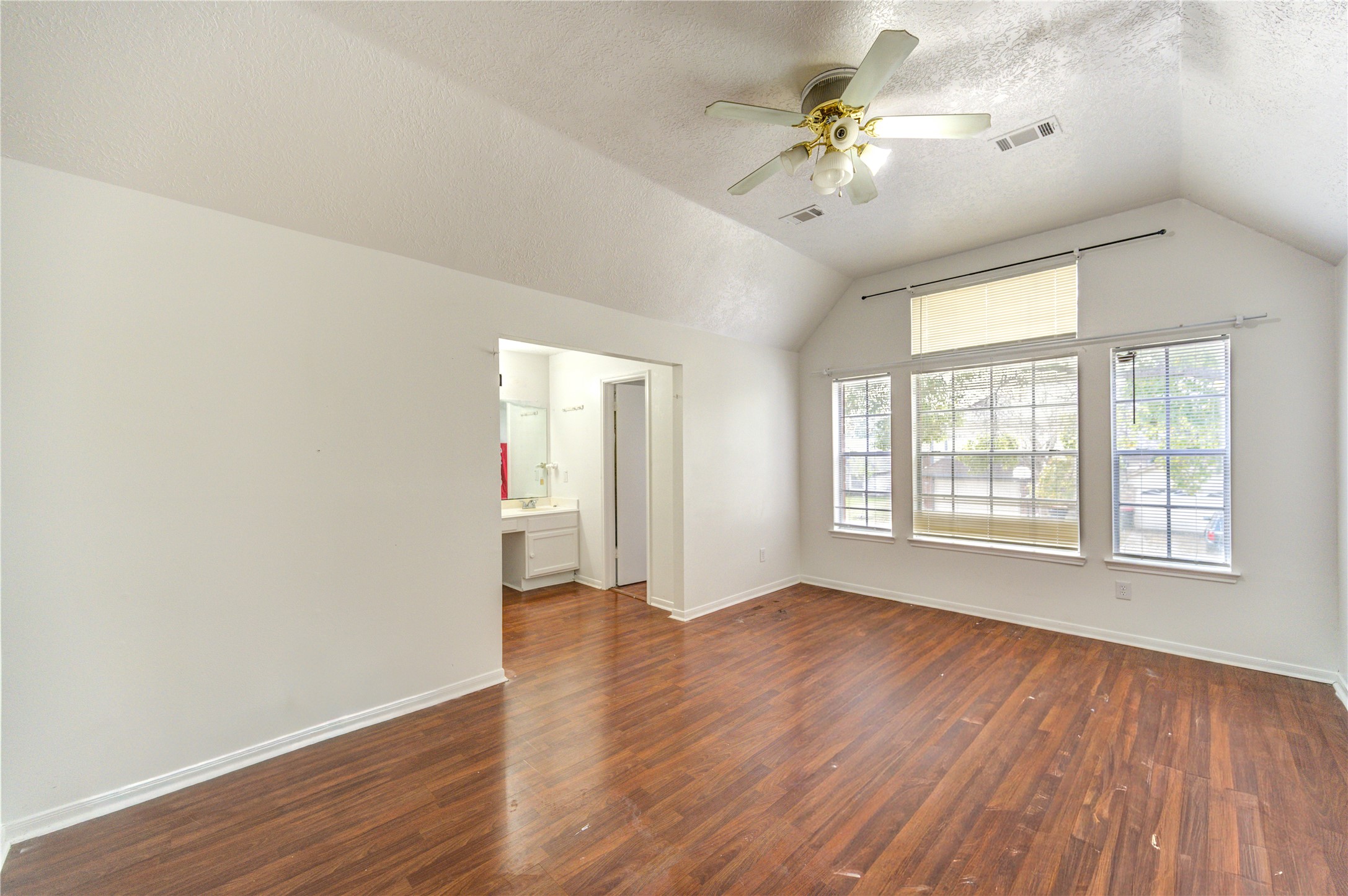 10338 Timberloch Drive Houston, TX 77070 - Photo 14 of 22 wooden floor in an empty room with a window