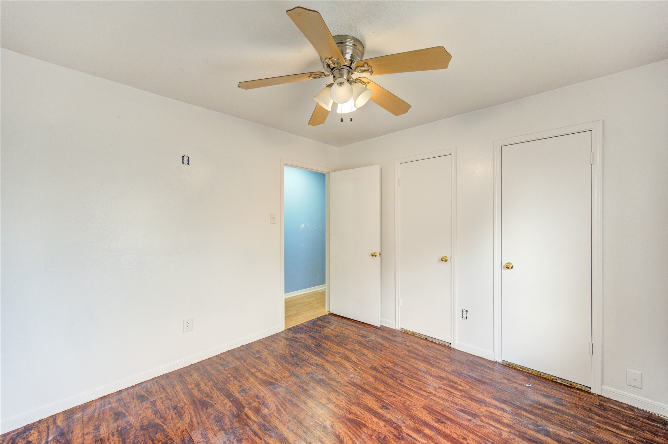 10338 Timberloch Drive Houston, TX 77070 - Photo 19 of 22 a view of an empty room with wooden floor
