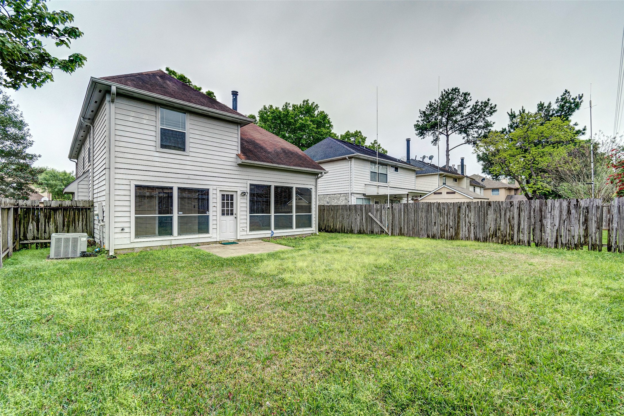 10338 Timberloch Drive Houston, TX 77070 - Photo 21 of 22 a view of a house with a backyard