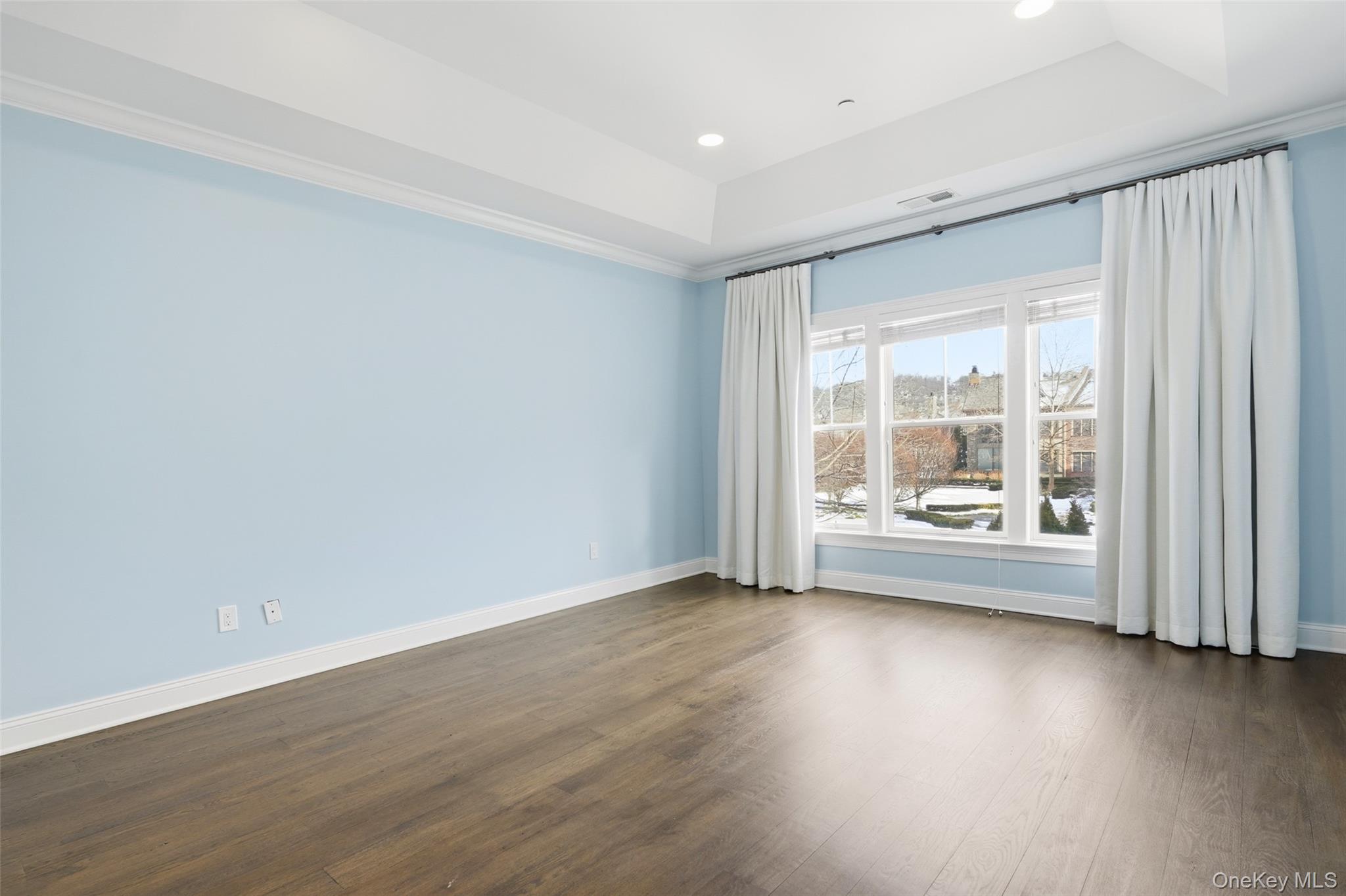 21 Rivers Edge Drive Tarrytown, NY 10591 - Photo 17 of 28 an empty room with wooden floor and windows