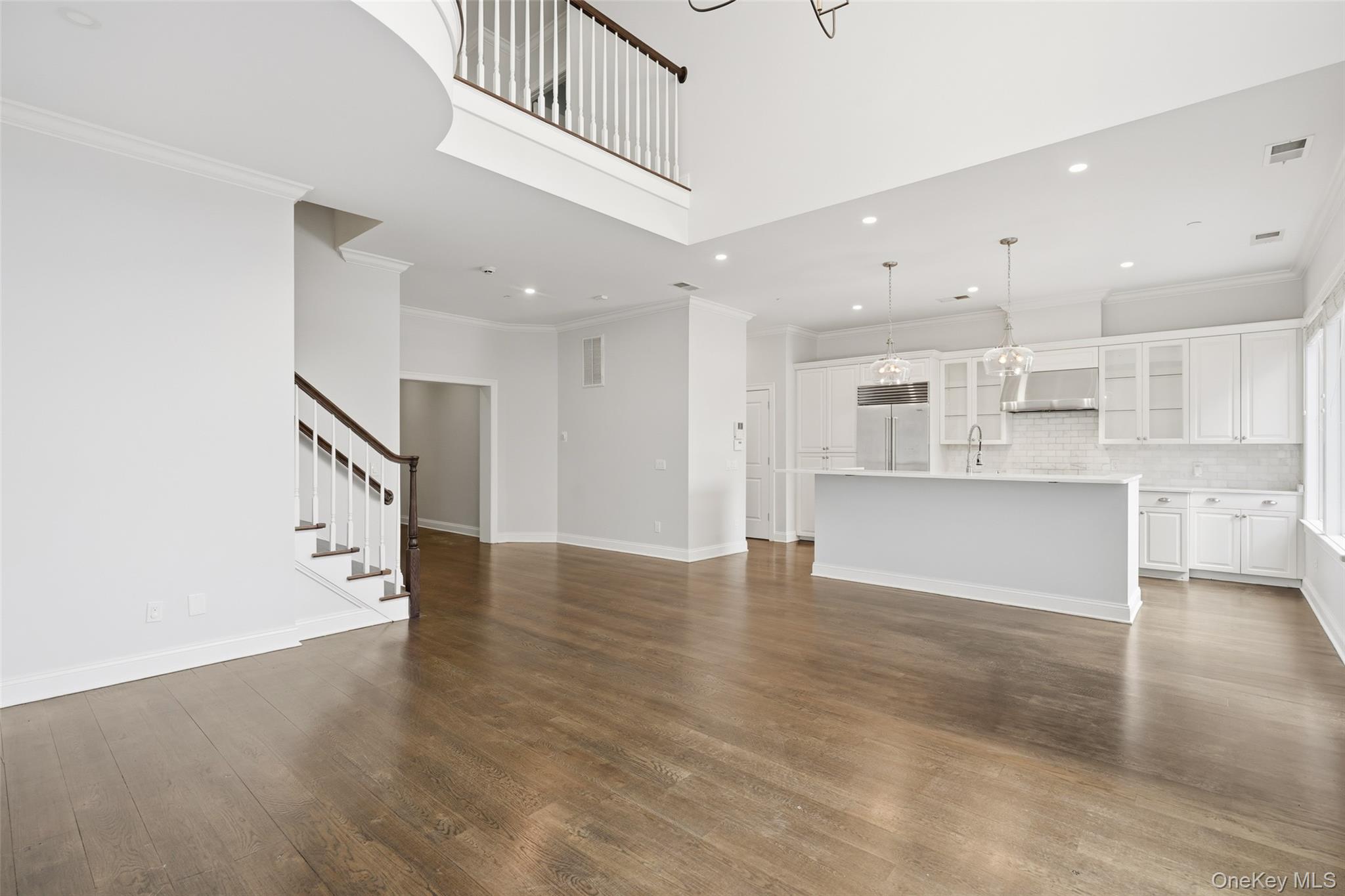 21 Rivers Edge Drive Tarrytown, NY 10591 - Photo 7 of 28 a view of a kitchen with an empty space and a refrigerator