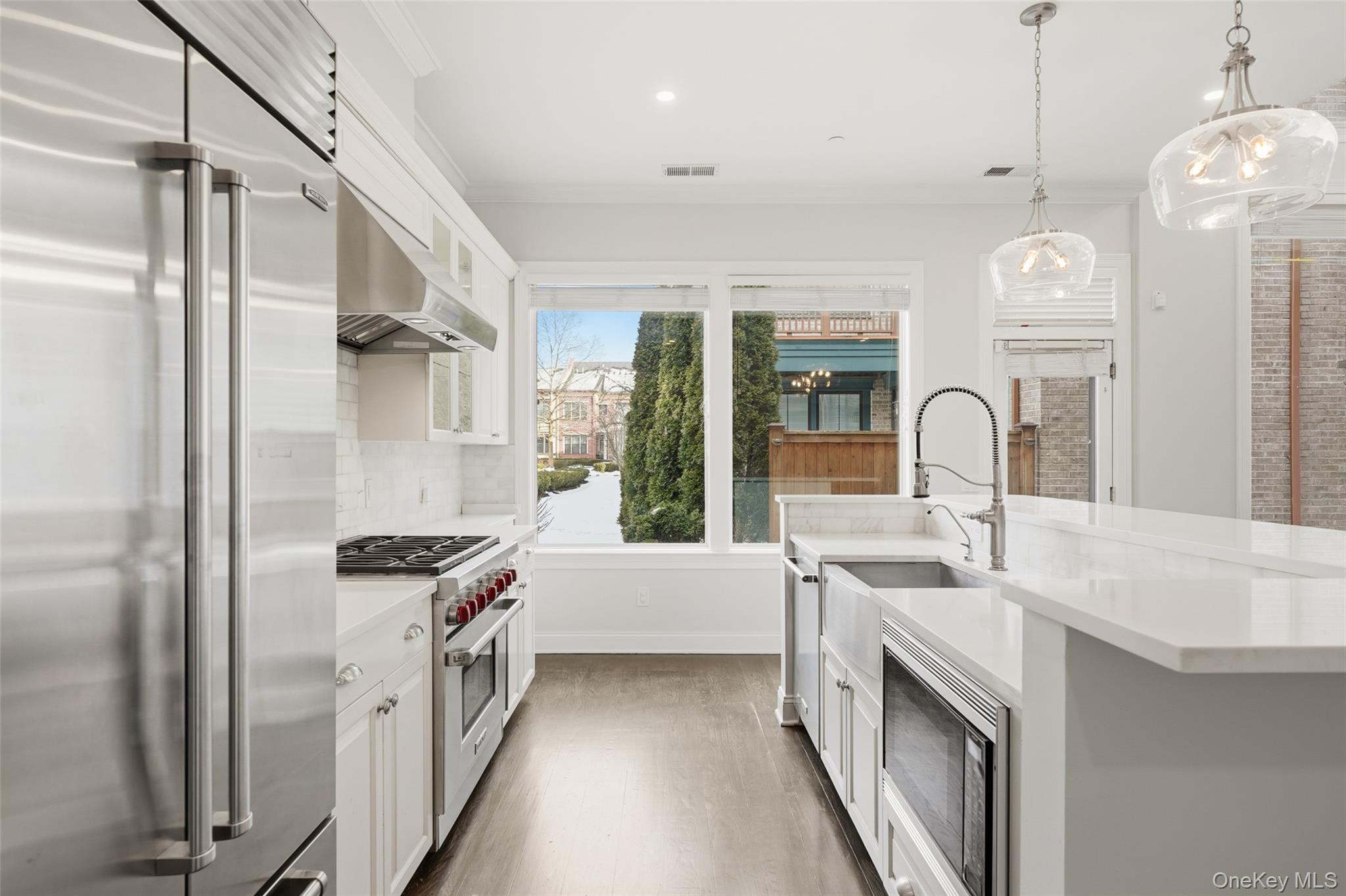 21 Rivers Edge Drive Tarrytown, NY 10591 - Photo 8 of 28 a kitchen with stainless steel appliances a sink stove and refrigerator