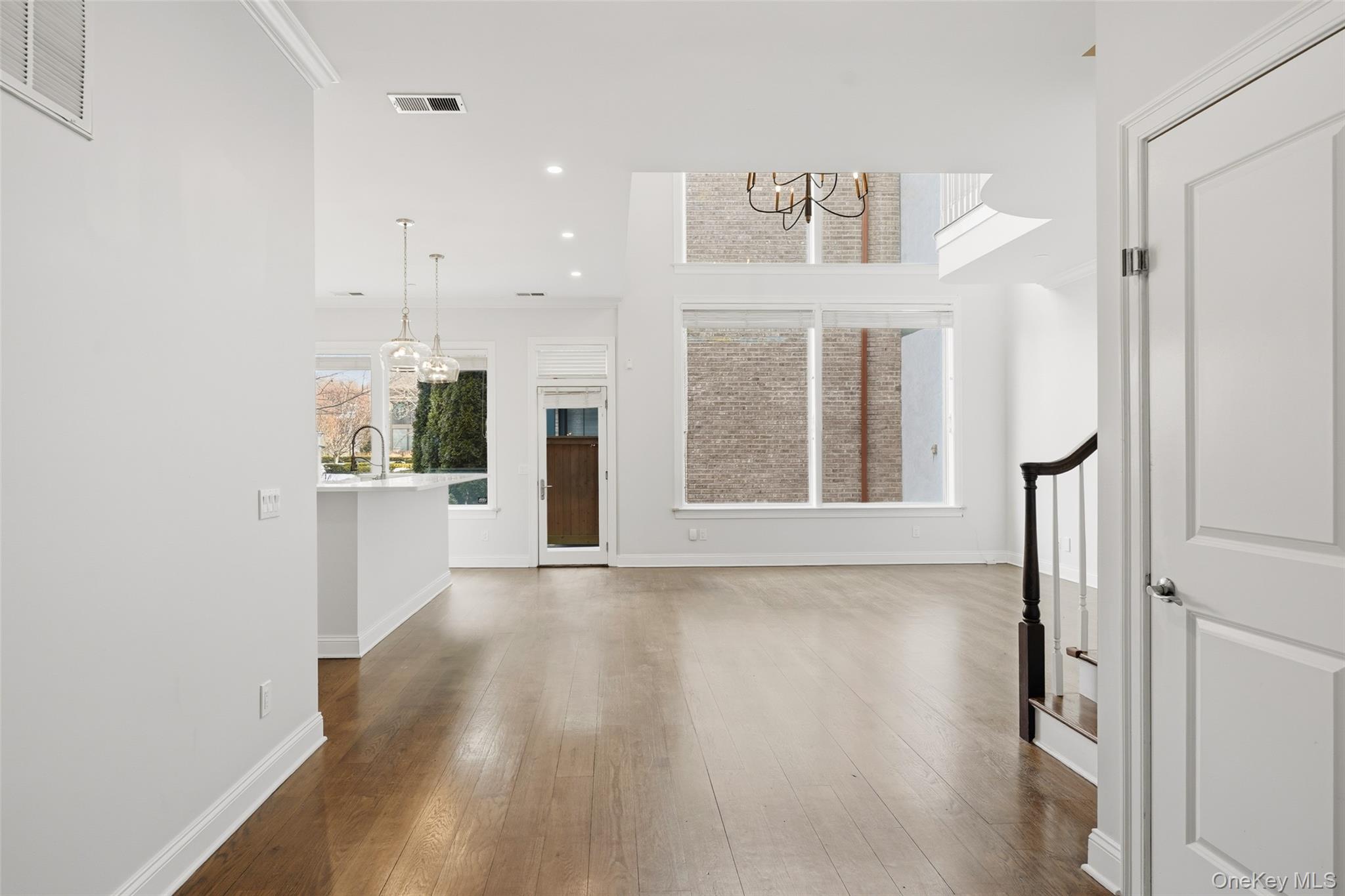 21 Rivers Edge Drive Tarrytown, NY 10591 - Photo 9 of 28 a view of an empty room with wooden floor and a window