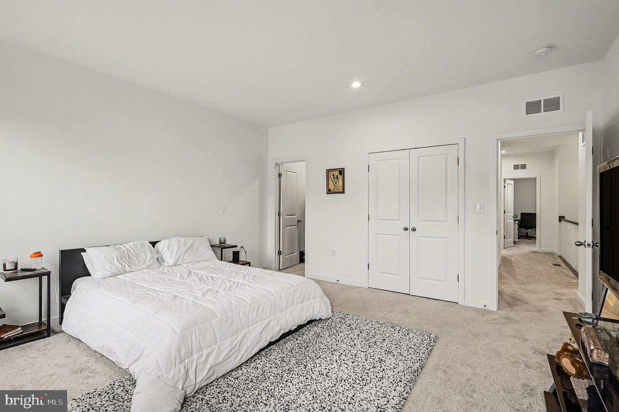 45956 Swallow Terrace Sterling, VA 20165 - Photo 12 of 29 a bedroom with a bed and closet