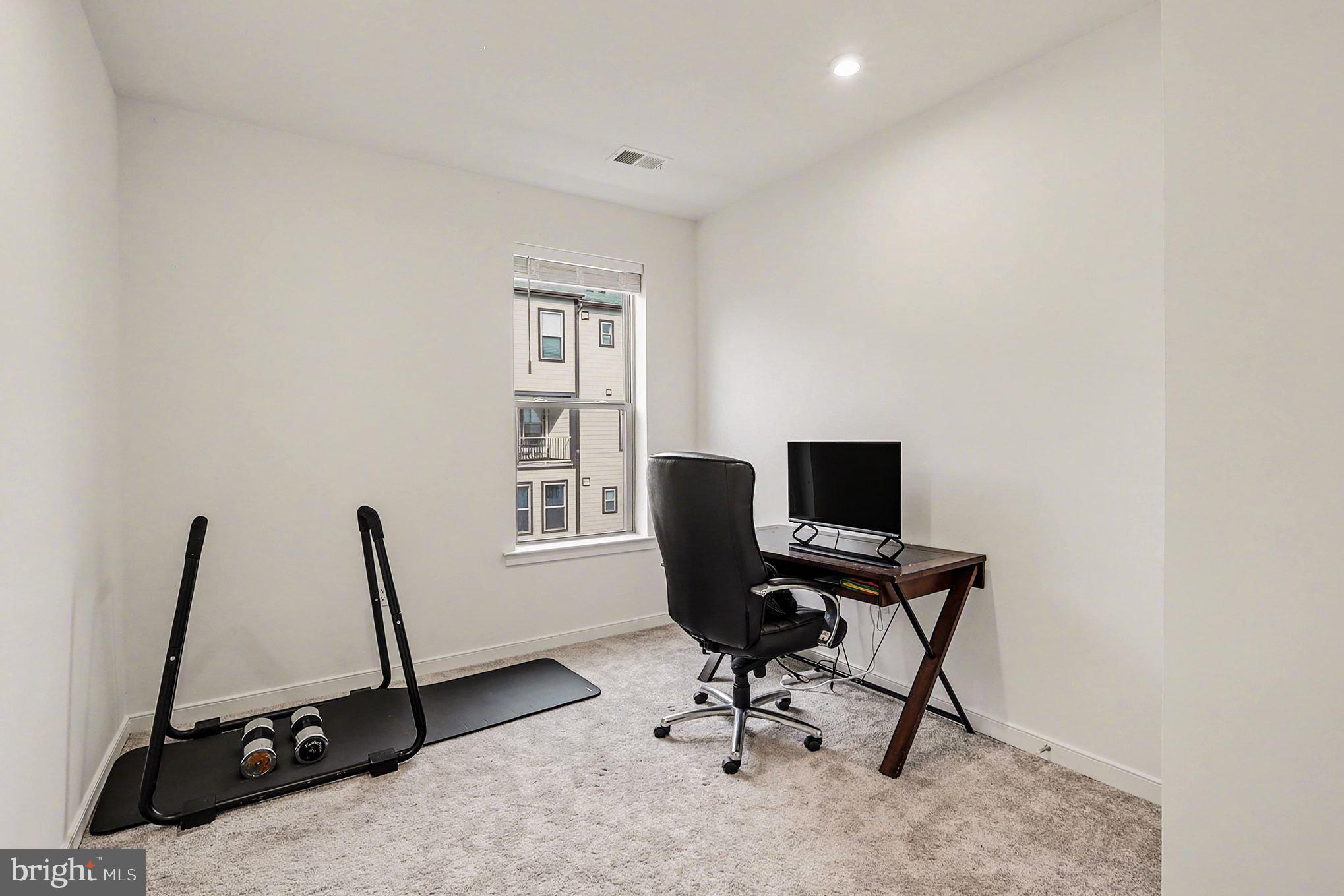 45956 Swallow Terrace Sterling, VA 20165 - Photo 20 of 29 a view of a workspace with furniture and a window