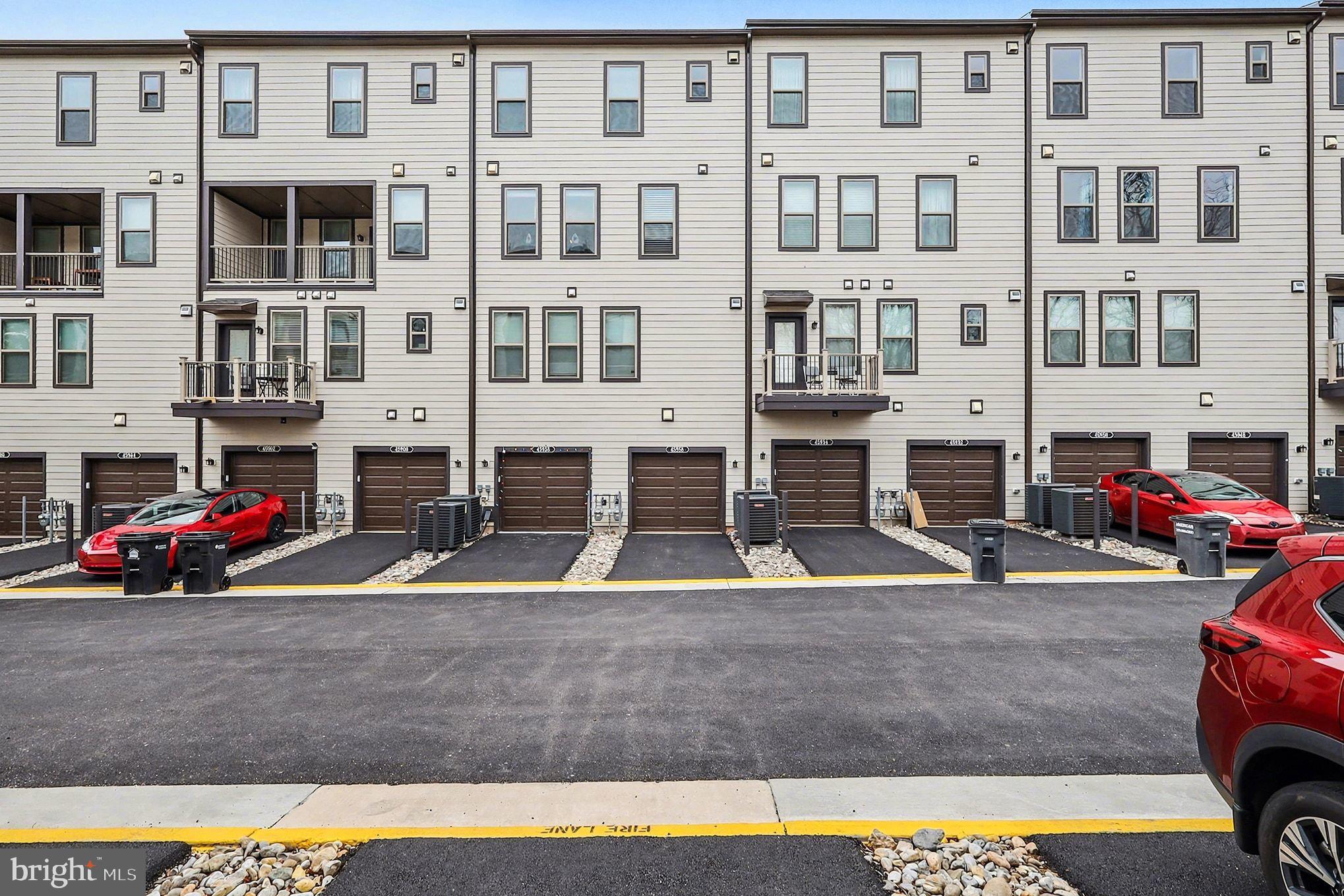 45956 Swallow Terrace Sterling, VA 20165 - Photo 26 of 29 a view of building with cars parked