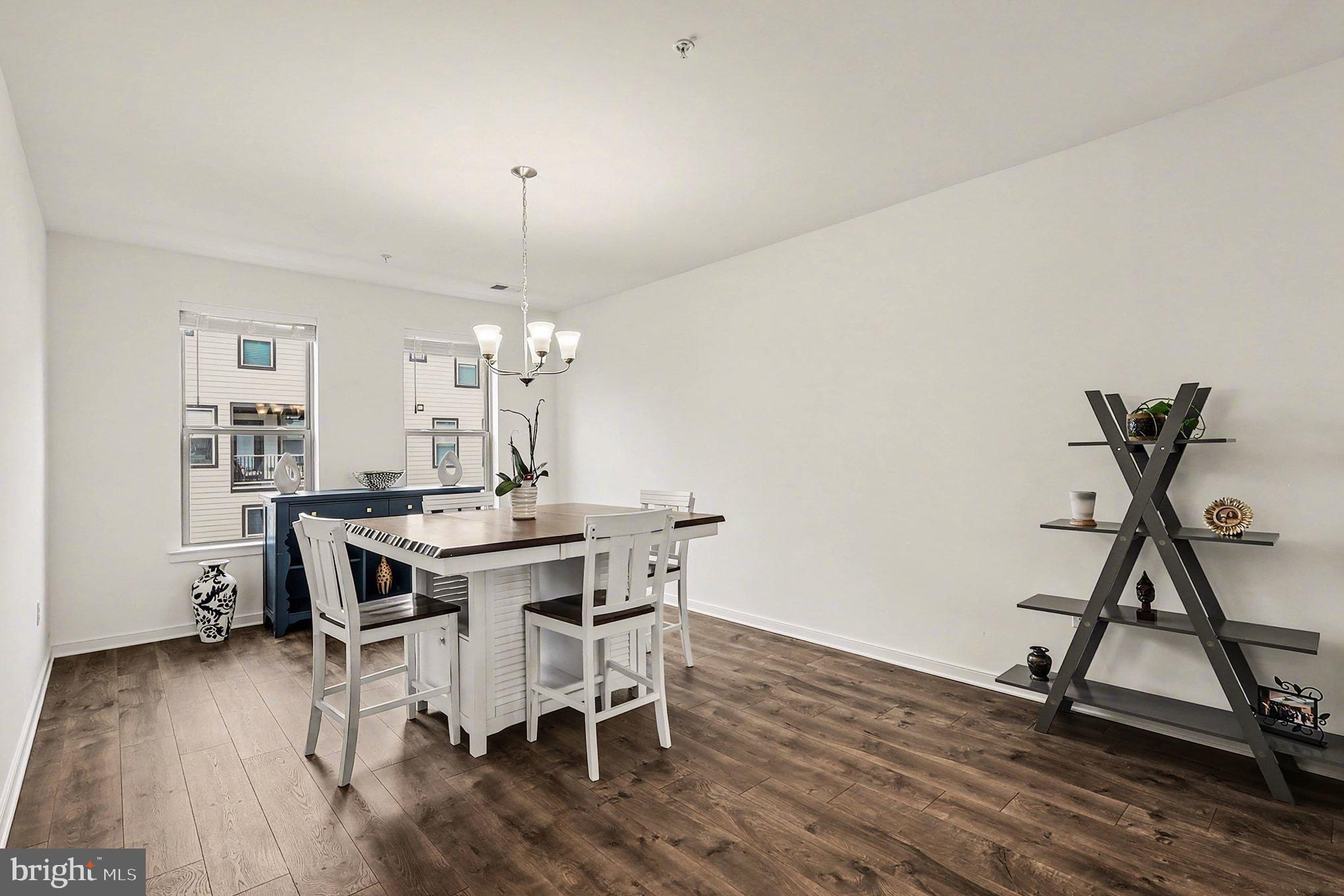 45956 Swallow Terrace Sterling, VA 20165 - Photo 6 of 29 a view of a dining room with furniture and wooden floor