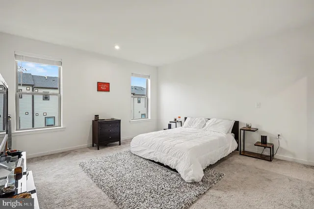 a bedroom with a bed and a desk