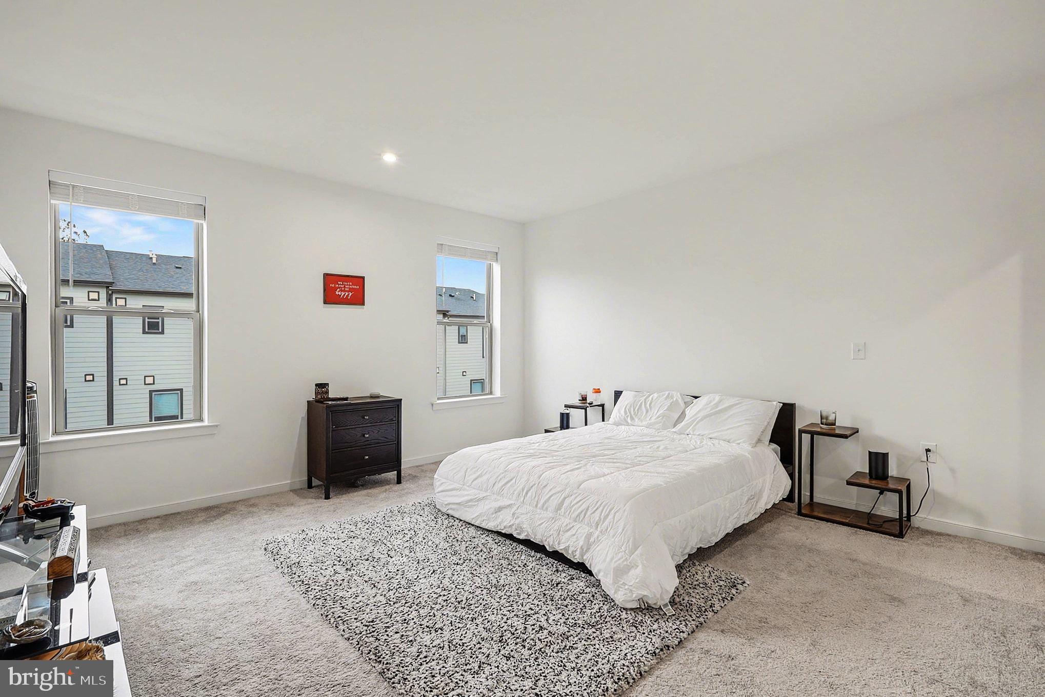 45956 Swallow Terrace Sterling, VA 20165 - Photo 10 of 29 a bedroom with a bed and a desk