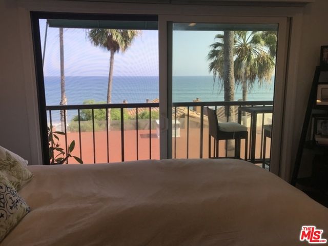 a view of a glass room with balcony