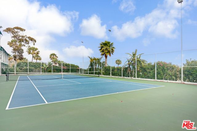 a view of an outdoor space and tennis court
