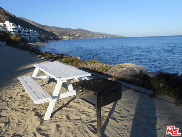 a view of balcony with furniture