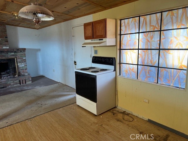 81821 Virginia Road Twentynine Palms, CA 92277 - Photo 19 of 41 a kitchen with stainless steel appliances granite countertop a stove and a microwave