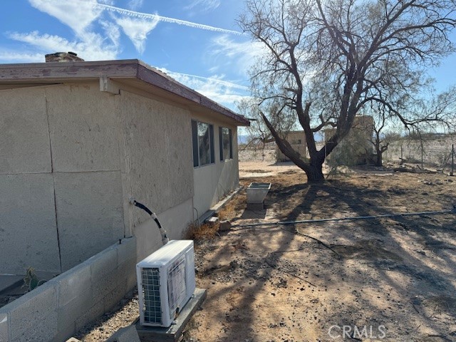 81821 Virginia Road Twentynine Palms, CA 92277 - Photo 10 of 41 a backyard of a house with table and chairs