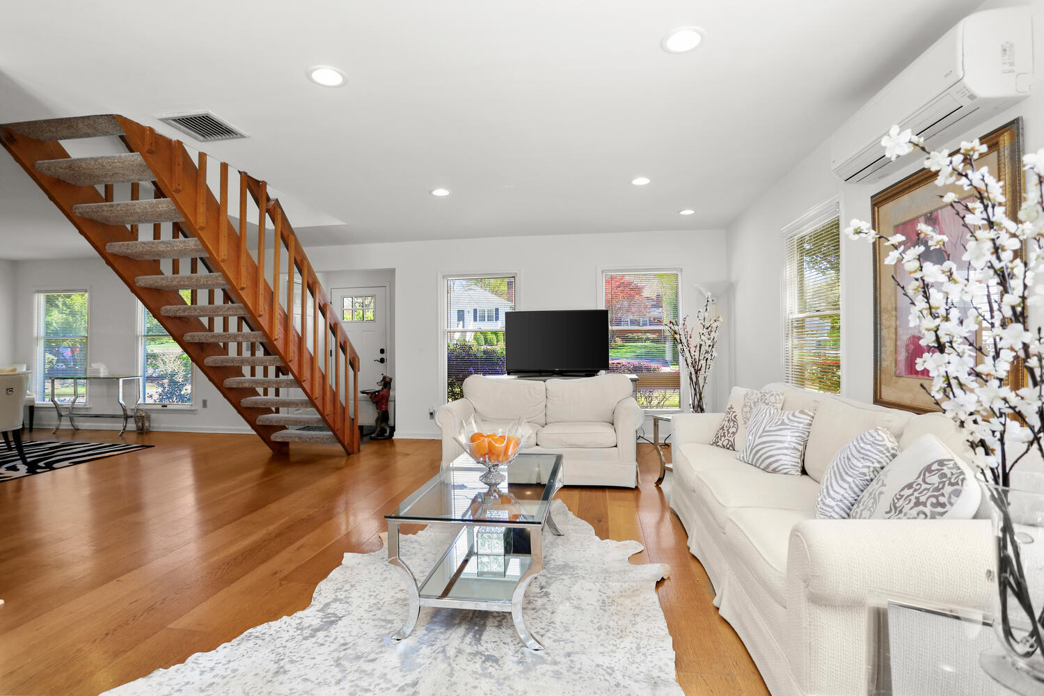 39 Sunshine Avenue Riverside, CT 06878 - Photo 6 of 34 a living room with furniture or stairs and a wooden floor