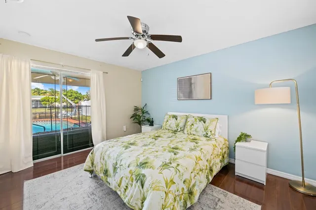 a bed sitting in a bedroom next to a window