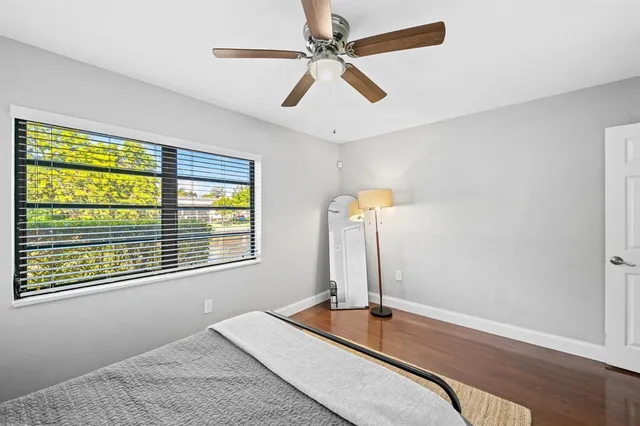 a room with a bed and a window