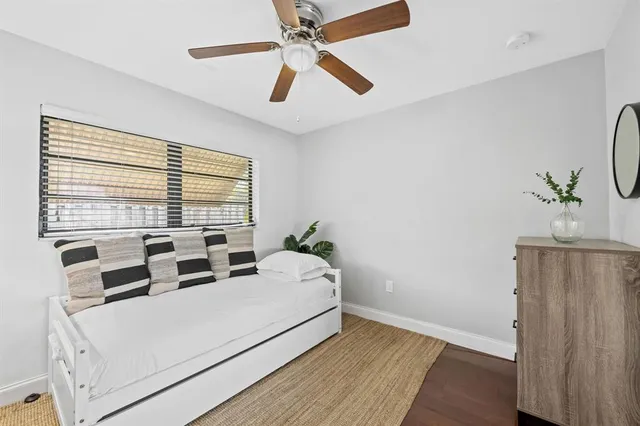 a bed room with a bed and a window