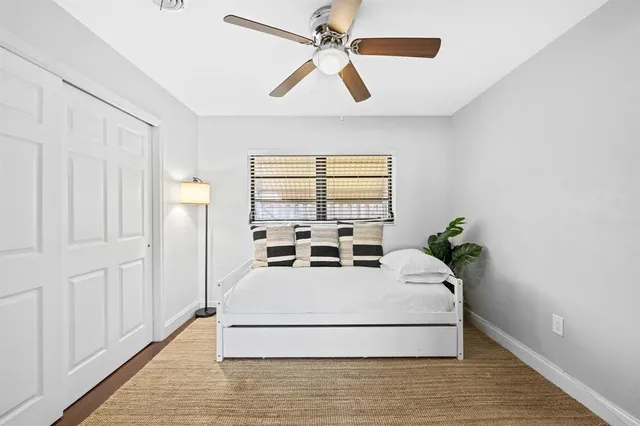 a living room with a bed furniture and a window