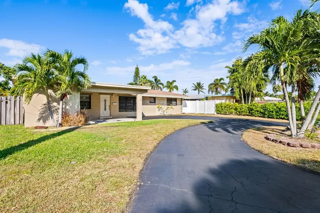 a house with swimming pool in front of it