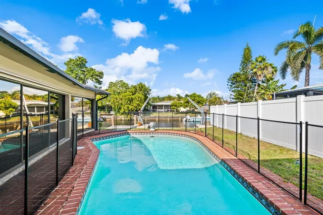 a view of a swimming pool with a porch