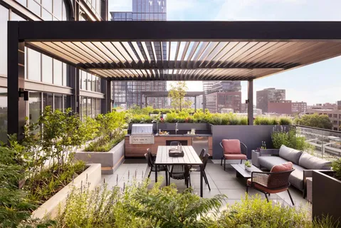 a outdoor living space with furniture and a potted plant