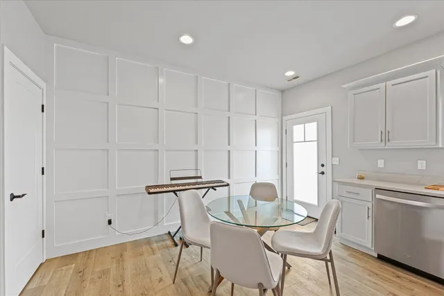 a view of a kitchen and dining area with cabinets
