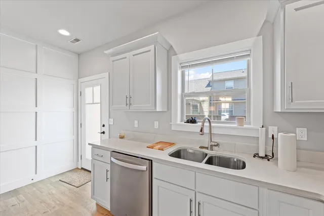 a kitchen with a sink and cabinets