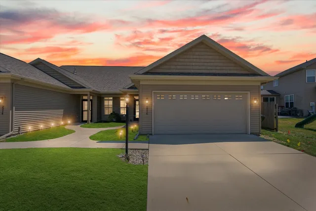 a front view of a house with a yard and porch