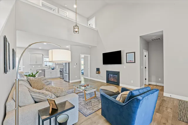 a living room with fireplace furniture and a flat screen tv