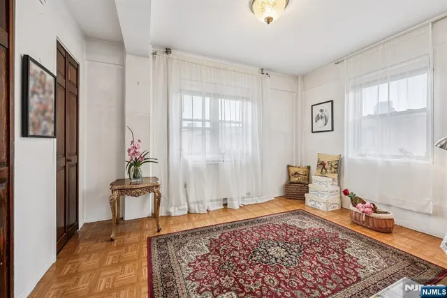 a living room with furniture and a rug