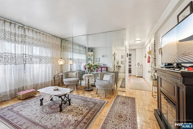 a living room with furniture and a rug