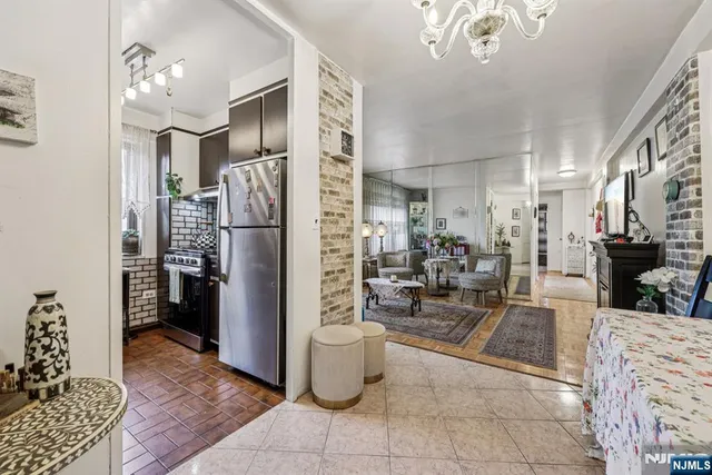 a kitchen with a refrigerator and a sink