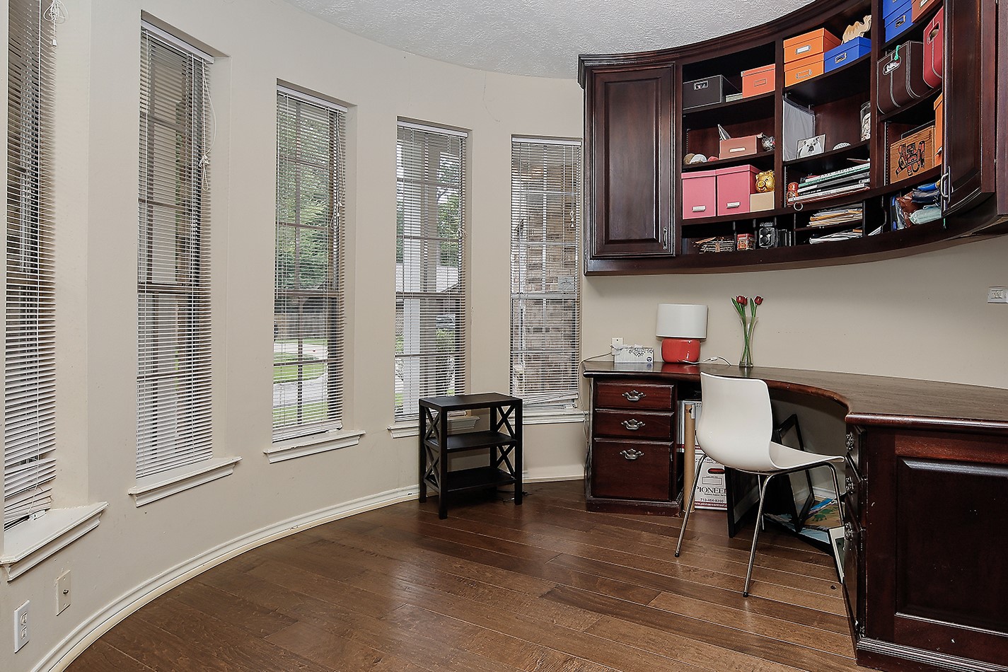 5 Indian Cedar Lane The Woodlands, TX 77380 - Photo 15 of 26 a view of room with furniture and wooden floor