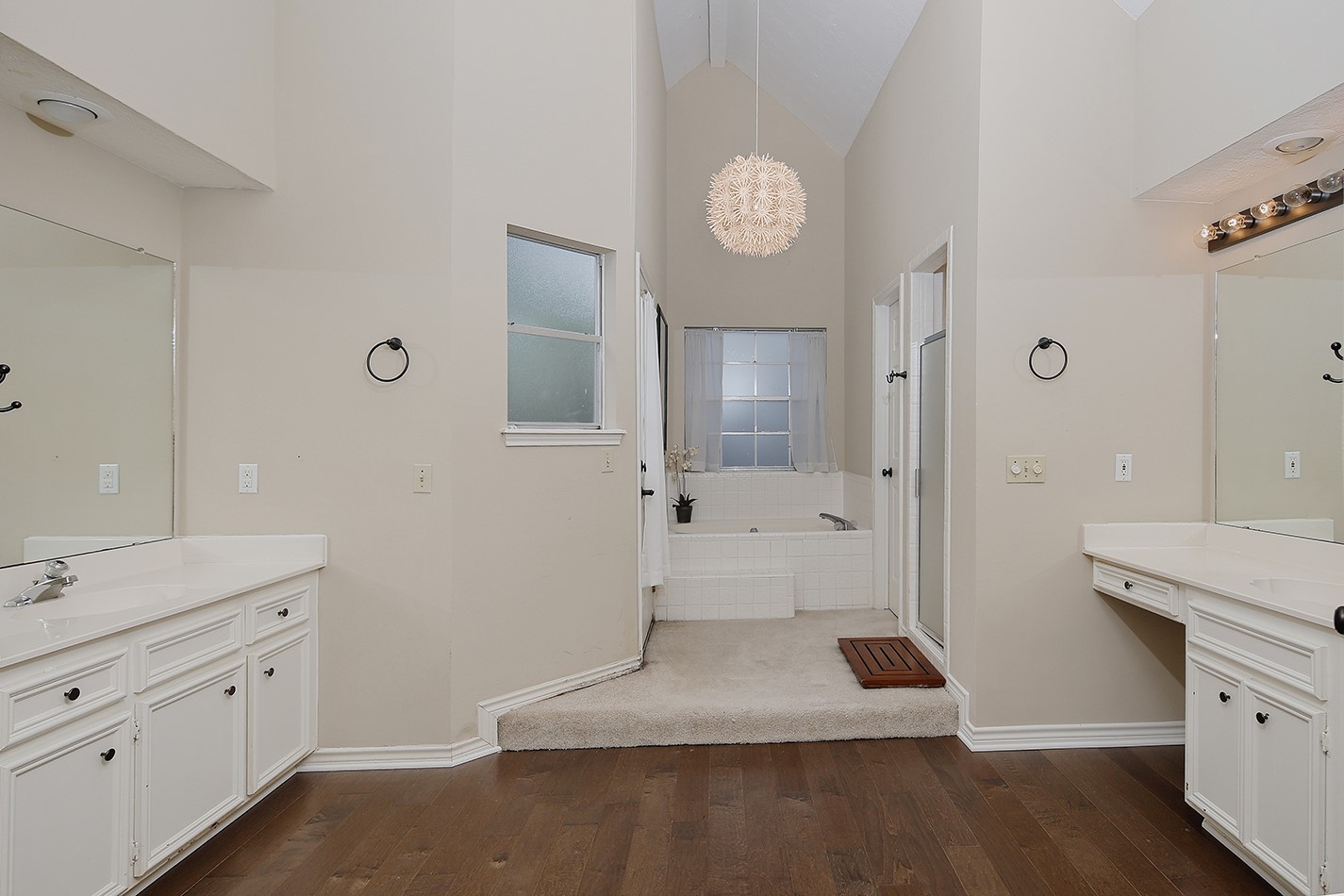 5 Indian Cedar Lane The Woodlands, TX 77380 - Photo 17 of 26 a spacious bathroom with a tub shower vanity and a sink