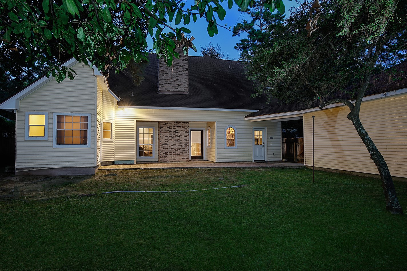 5 Indian Cedar Lane The Woodlands, TX 77380 - Photo 25 of 26 a front view of a house with a garden