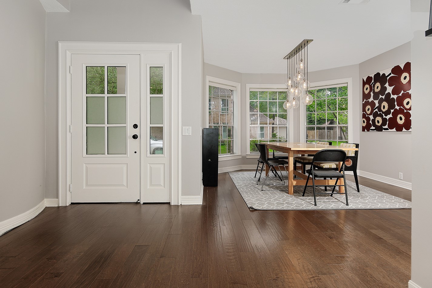 5 Indian Cedar Lane The Woodlands, TX 77380 - Photo 4 of 26 a view of a dining room with furniture window and wooden floor