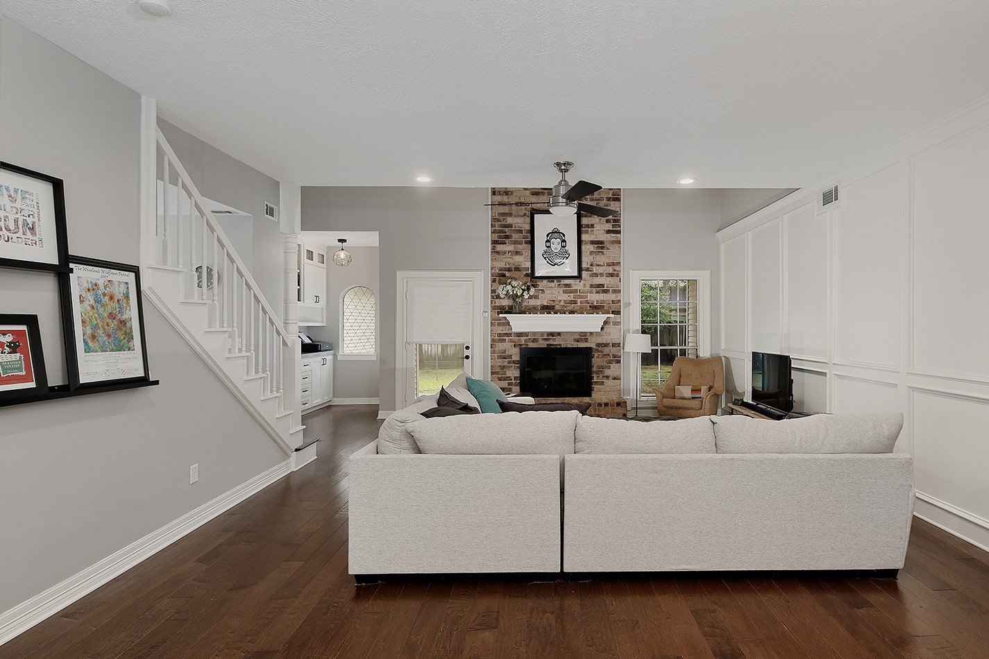 5 Indian Cedar Lane The Woodlands, TX 77380 - Photo 7 of 26 a living room with furniture and a fireplace