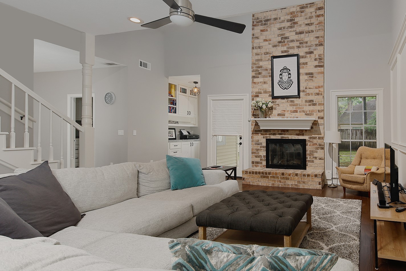 5 Indian Cedar Lane The Woodlands, TX 77380 - Photo 8 of 26 a living room with furniture and a fireplace