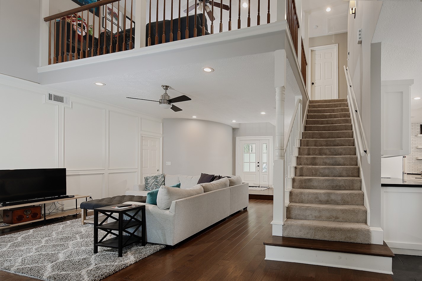 5 Indian Cedar Lane The Woodlands, TX 77380 - Photo 9 of 26 a living room with furniture and a flat screen tv